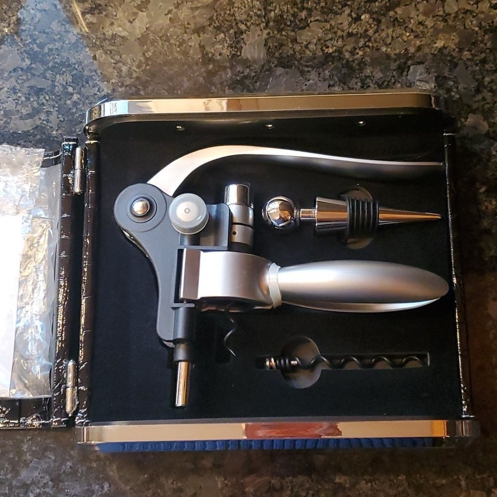New! Wine opener, bottle cork and extra spiral piercer.  All in an elegant case!